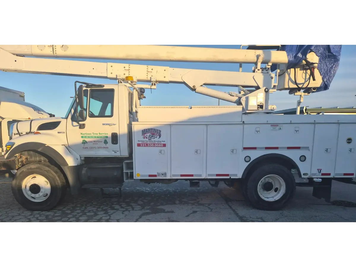 Martinez Tree Services bucket truck ready for tree work in Aurora